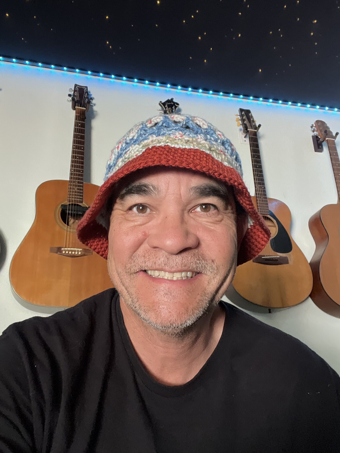 A red, blue and cream winter hat